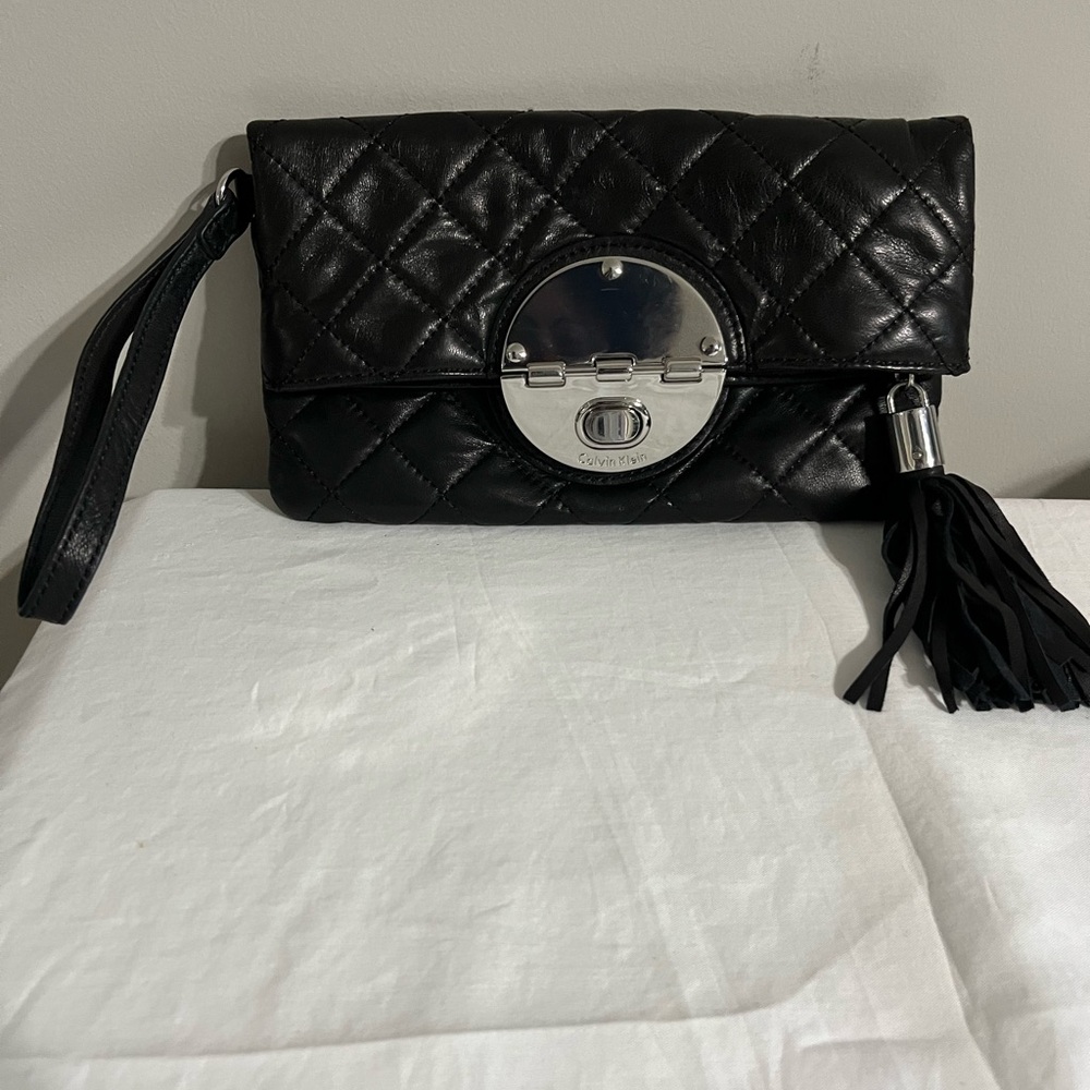 Black Calvin Klein quilted leather clutch bag with stunning silver hardware.
